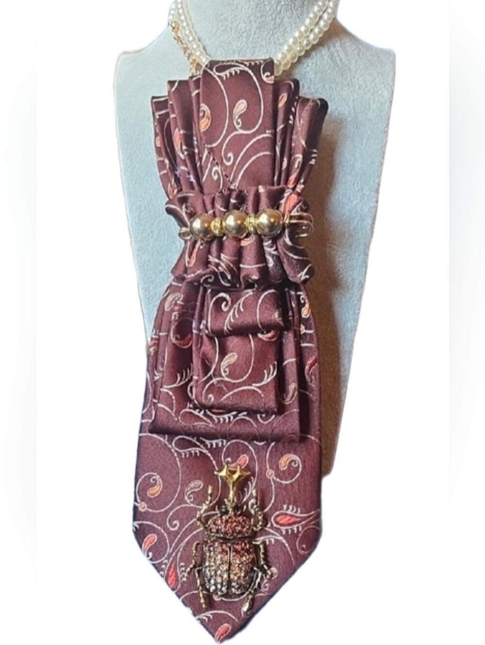 3/$60 Brown Orange Paisley Cravat with Gold Beetle Accent Brooch